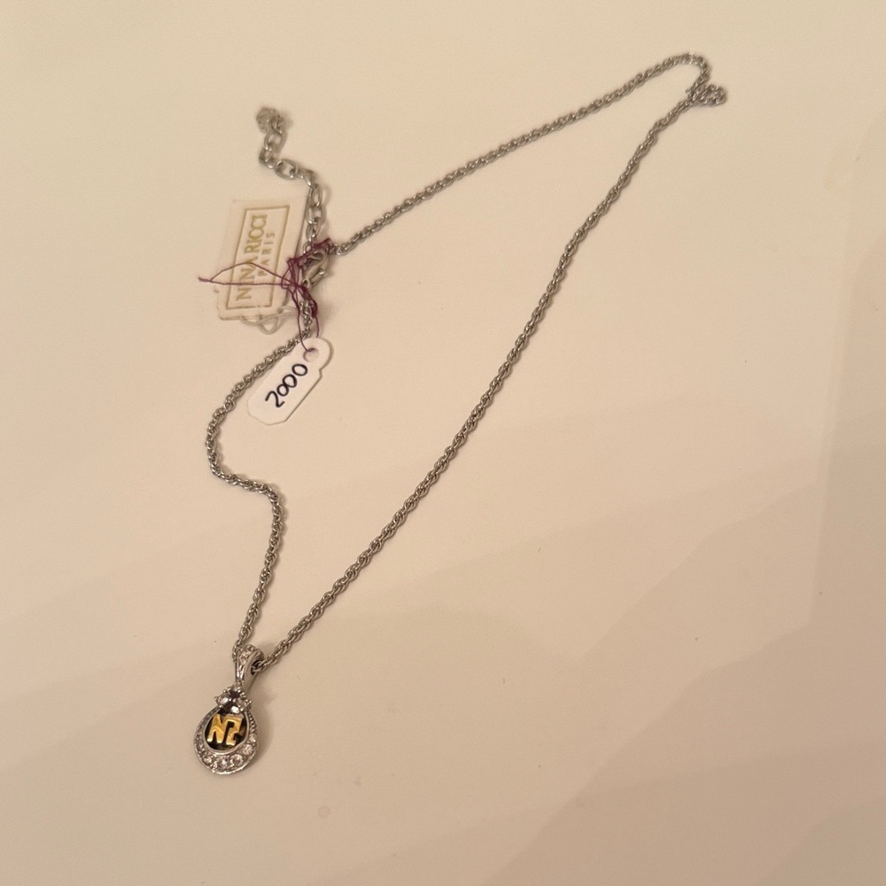 Nina Ricci Silver Necklace with Gold Pendant